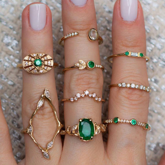 Ring with emeralds and diamonds